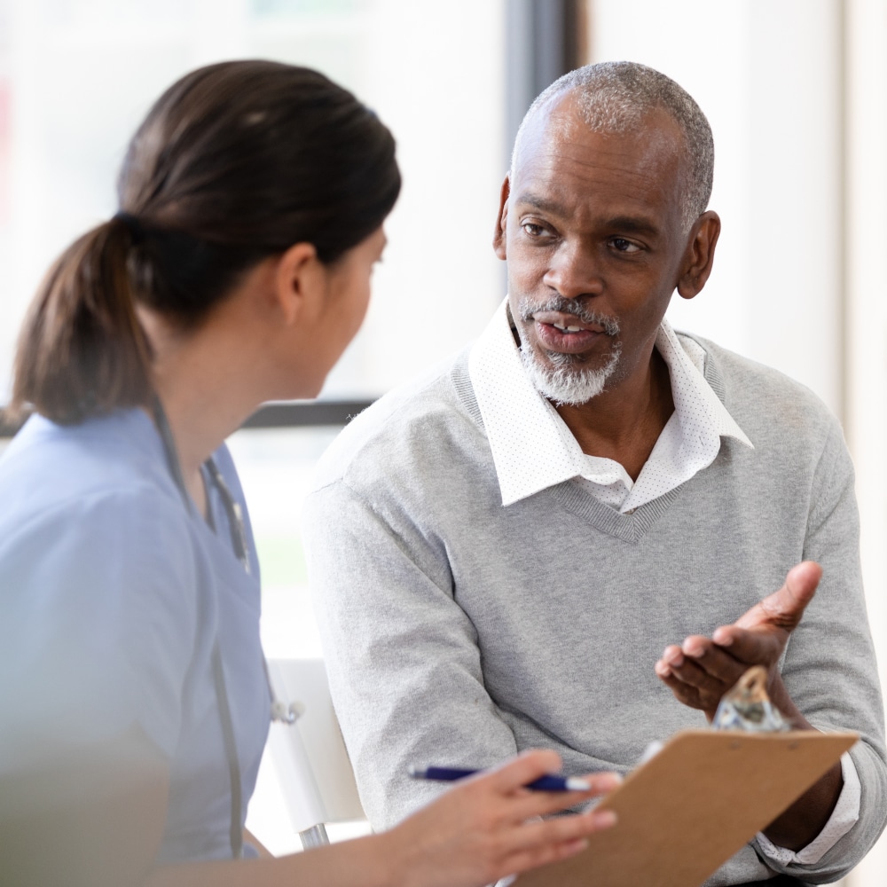 A provider talks with a patient